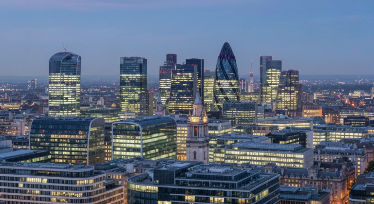 London's iconic cityscape at twilight with illuminated buildings and modern architecture.